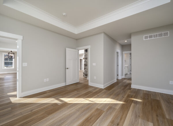 Photo of the primary suite in the Newport floorplan by Foxlane Homes