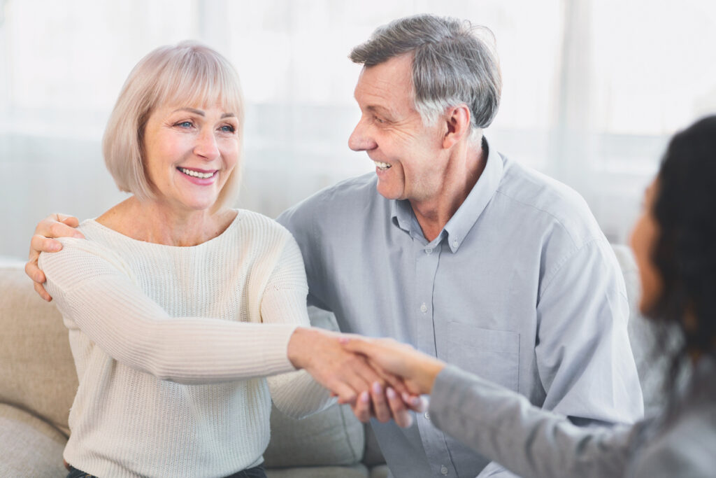 mature couple meeting with sales associate