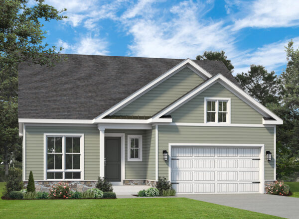 A two-story suburban house with green siding, white trim, a dark gray roof, and a white double garage. There are trees and grass around the house and a clear blue sky overhead.