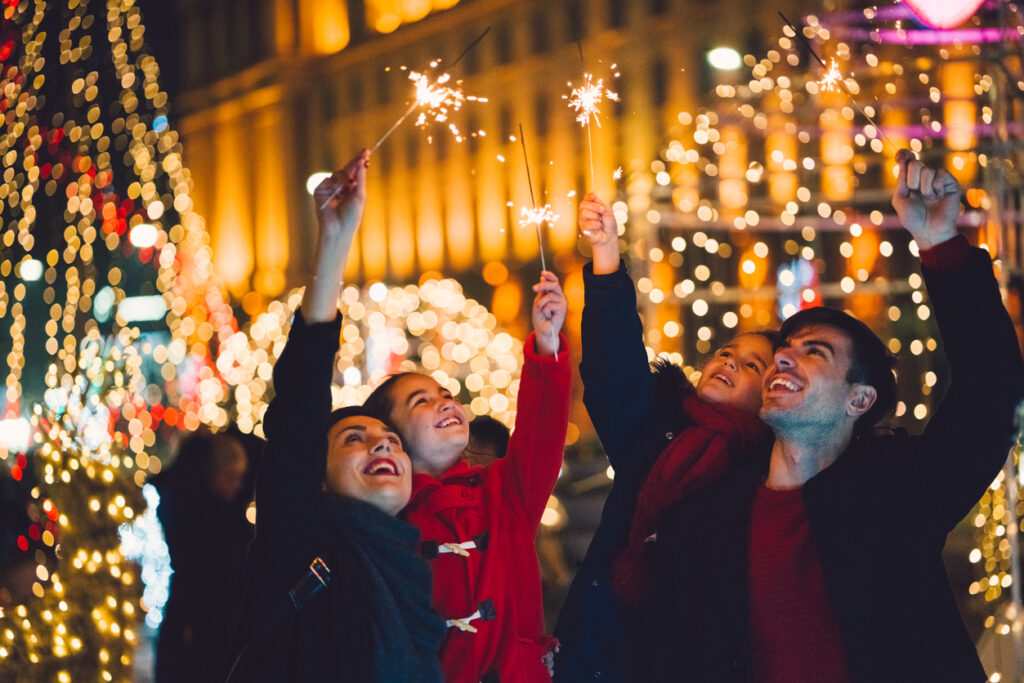 Young family with two kids celebrating New Year