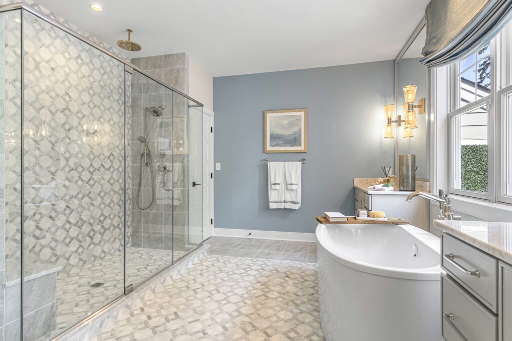 a luxurious tiled bathroom in a foxlane homes model home