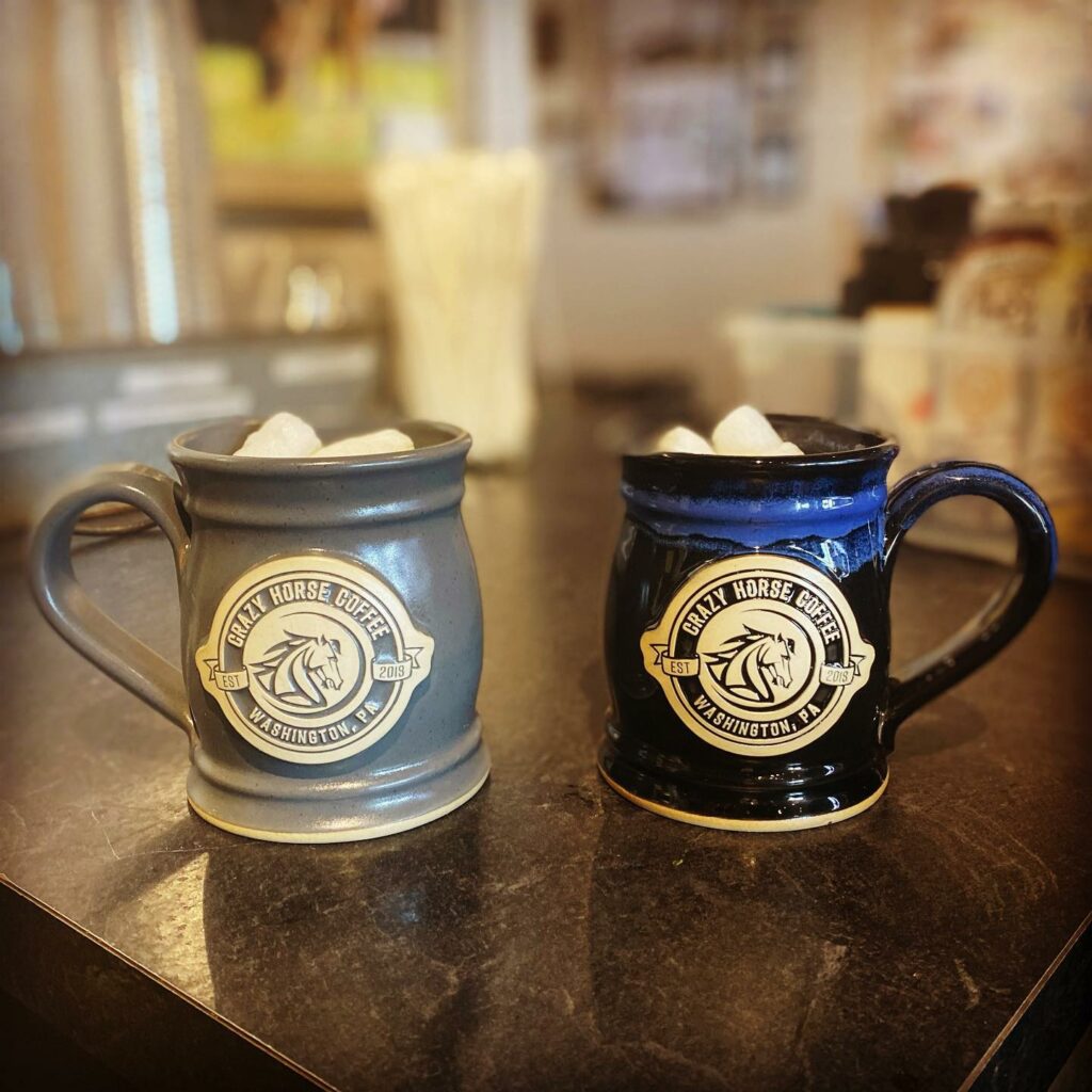 Two Crazy Horse Coffee mugs on the counter