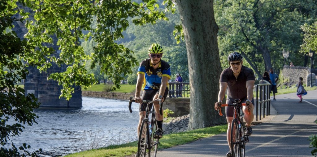 two people biking along the schuylkill river trail