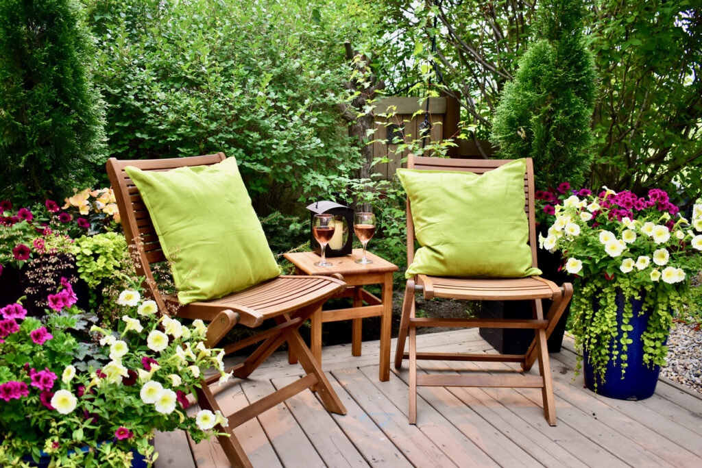 backyard patio with colorful potted flowers