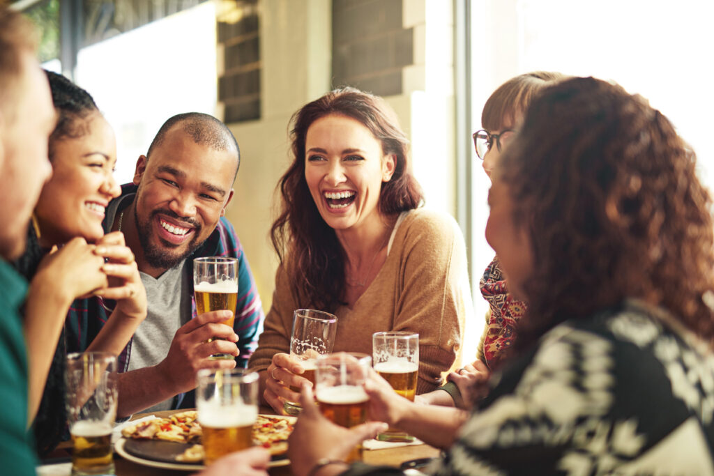 Shot of a group of friends hanging out and having beer