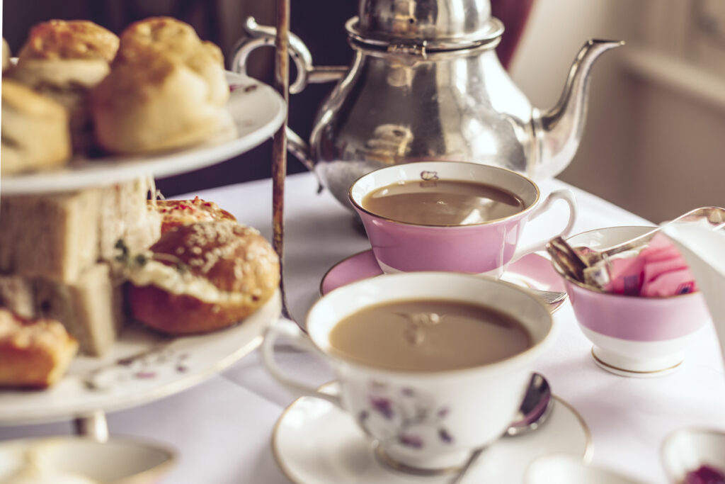 afternoon tea table of teas and food