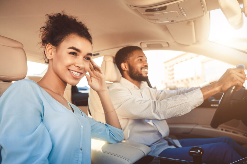 Road Trip. Happy Black Couple Driving Sitting In Car 