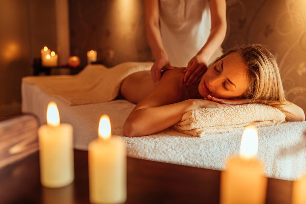 Young woman enjoying a massage at a spa