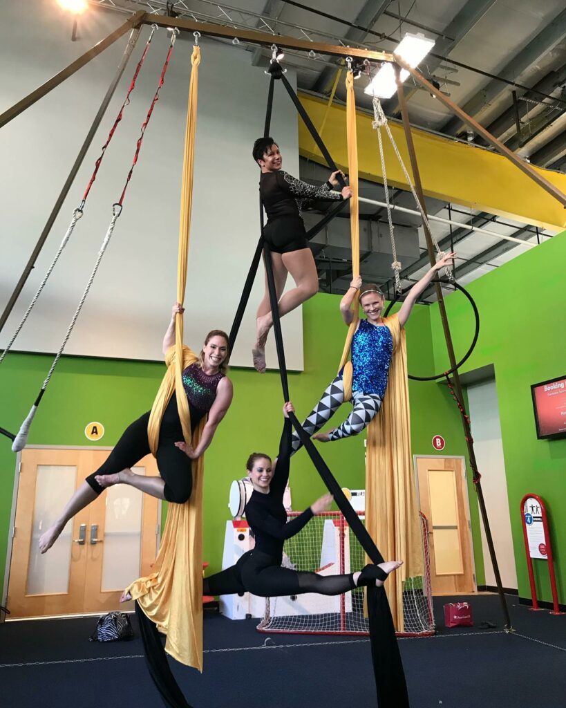 people learning aerial acrobatics at the pittsburgh circus center
