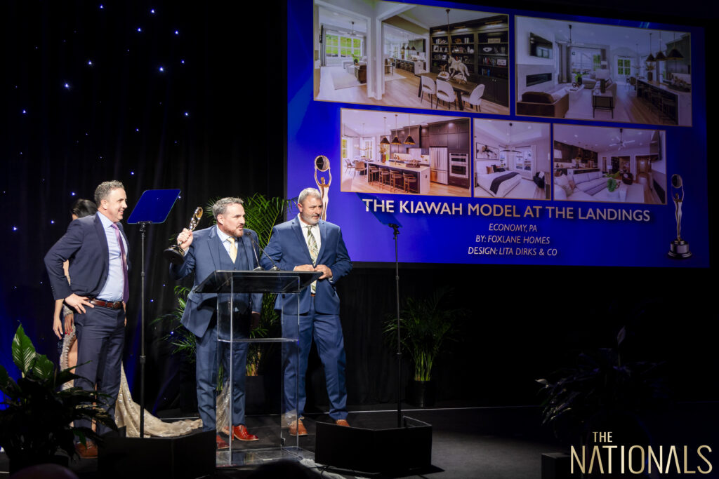 foxlane team accepting an award on stage at the nahb nationals awards