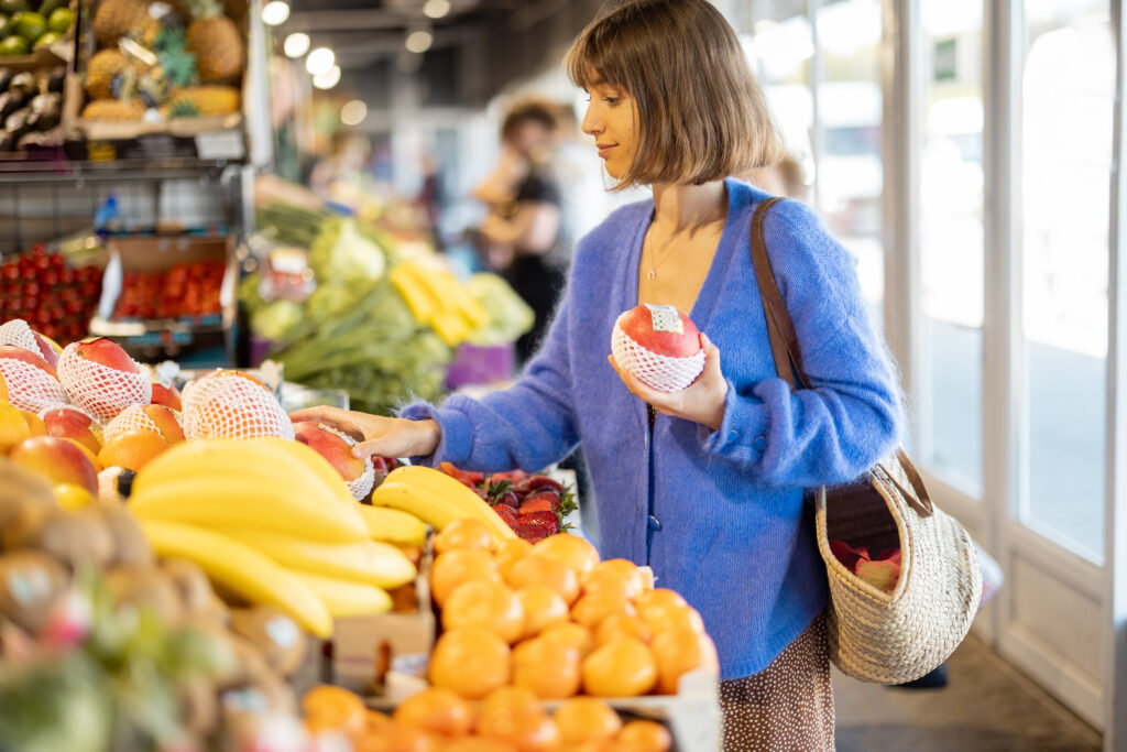 woman shopping locally for fruit and veggies