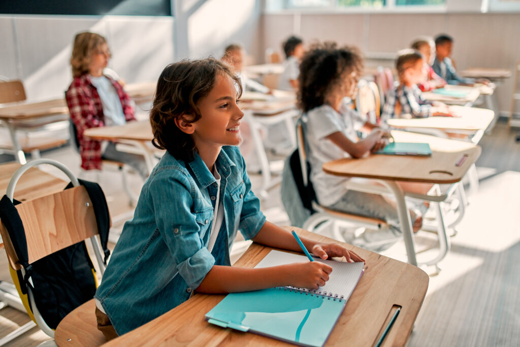 happy kids learning in a classroom