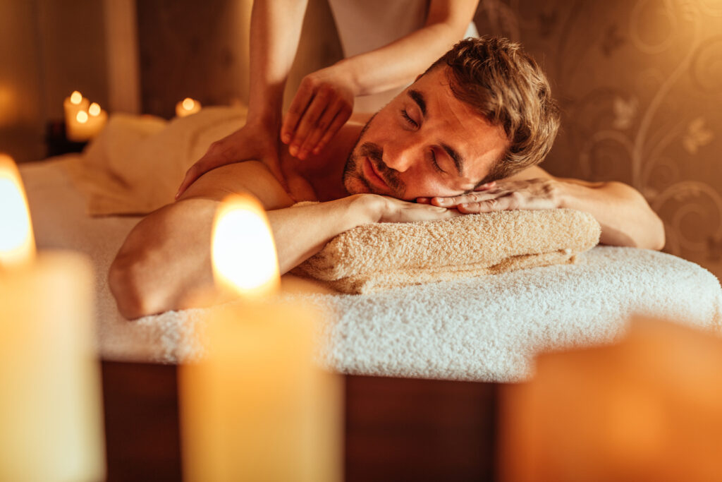 man enjoying a massage at a spa