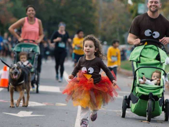 family running in a turkey trot