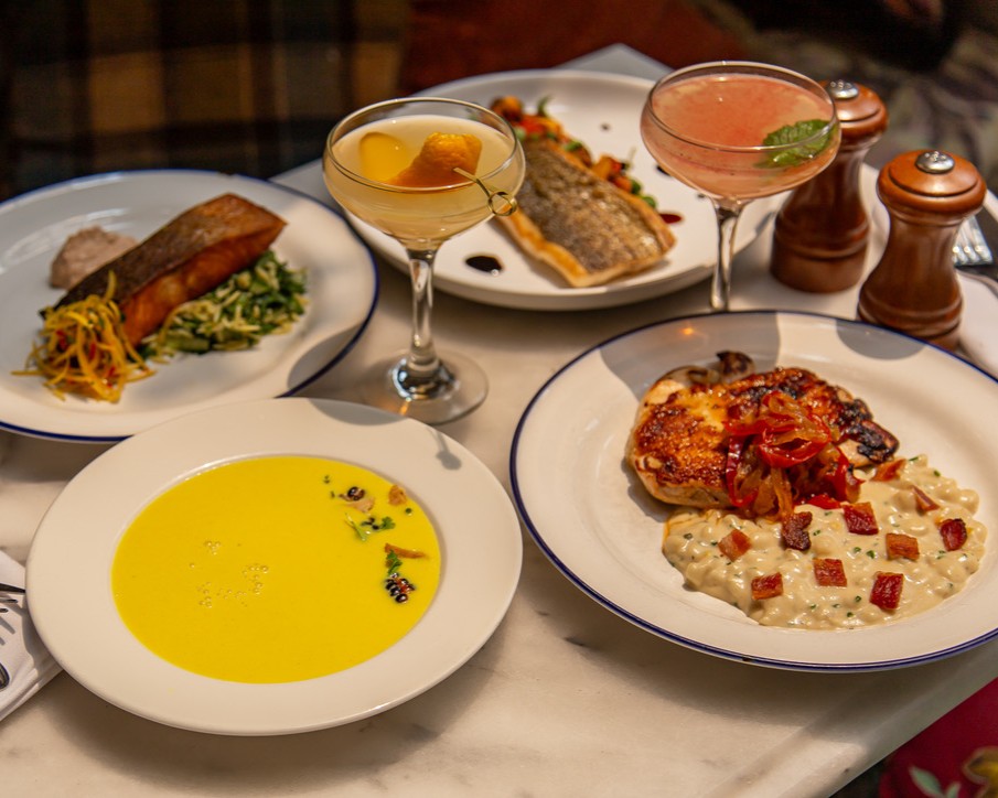 table of hearty food dishes from white dog cafe in philadelphia