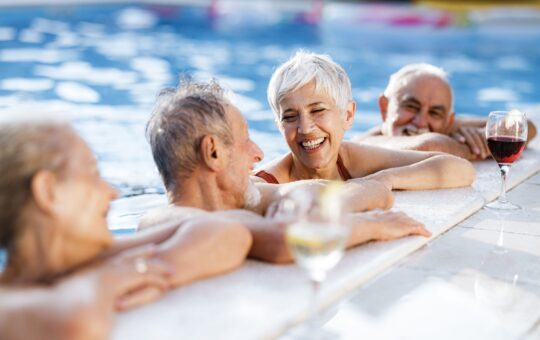 group of mature adults in pool
