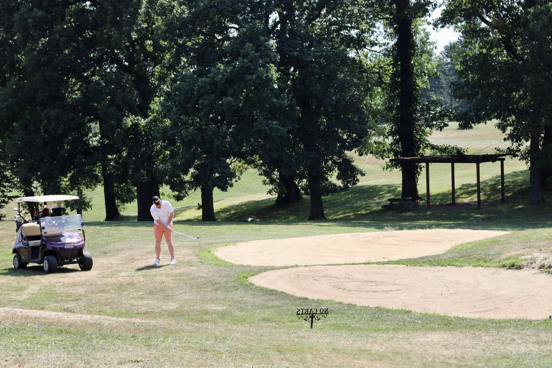 golfer taking a swing at harmony ridge golf club in pittsburgh