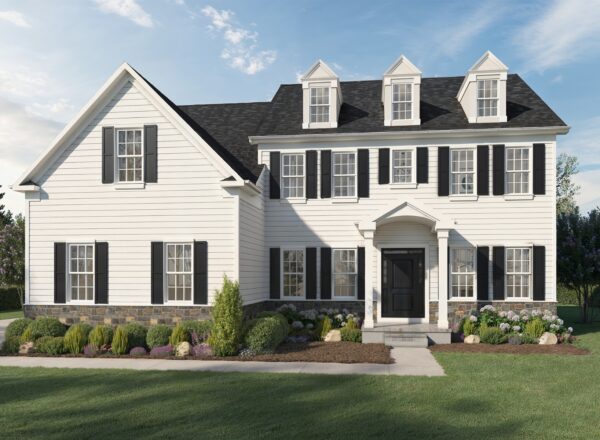 A large two-story white house with black shutters, a dark roof, stone accents, and neat landscaping on a green lawn under a blue sky with scattered clouds.