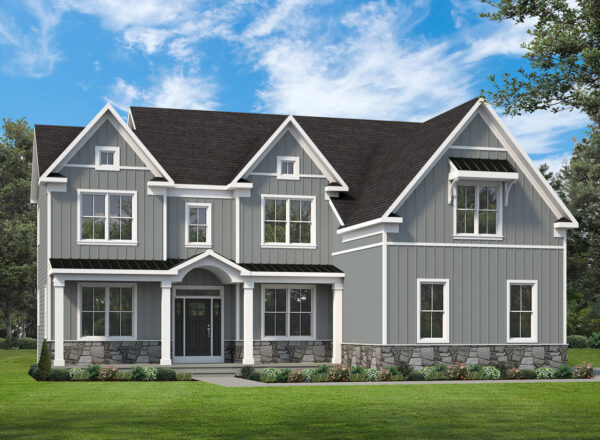 Two-story gray house with white trim, black roof, large windows, stone foundation, front porch, and landscaped lawn, set against a blue sky with scattered clouds and surrounded by green trees.